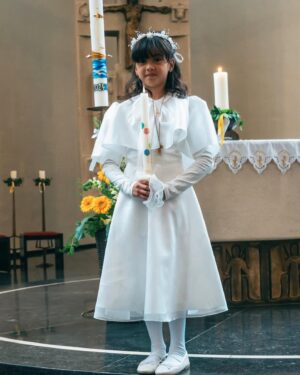 Helga Krapf Instagram - Another milestone: Amelie’s first holy communion. 🙏🏼 She was so excited for this and was so kilig to finally get to try that “white thing” mommy always eats in mass. 🙈😆😅

Made sure she got a piece of home with her by letting her wear a custom made Filipiniana inspired @thehouseofenchante dress. She looked like a little priestess 😍 Her candle is from Portugal, blessed at Our lady of Fatima which we then designed together using wax paper. The cake was made by me with the help of @puratosph 🤭 Only the best for my little miss. 👧🏻 

Thank you to our family and friends, and to those who helped make this happen. ☺️

To Amelie, Congratulations on your first holy communion. May God bless and protect you always my love. Love you to the moon and back. 🥰🙏🏼