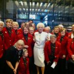 Holland Taylor Instagram – The Kennedy Center Ushers for the Eisenhower Theatre, specifically the Thursday night gang, were a wonderful group who responded so incredibly to ANN during our previews there, speaking their mind to my director Ben Klein, that I became determined to continue to hear from them.

The ushers generally had no access to the innards of the artist’s side of the theatre or the fabled Green room, which was a huge chandelier and couch filled haven where the great and garden variety folks came after the performance. I pled the case with KC management that, since I was the only performer, I felt they should allow the ushers to visit after the show along with other friends if I wanted that.  So, permission was granted, and for the first time, the “Redcoats,” as I called them, started appearing after the show — three one night, eight another — during the month ANN played there. Our last Saturday night happened to be my birthday, and the gang just floored me by arranging on their own for champagne and a birthday cake to celebrate, and ALL of them (a big group of about 30), it seemed, in attendance. I never will forget it. 

But nothing prepared me for the night on Broadway, more than a year later, when about 35 of them appeared IN THEIR Kennedy Center REDCOATS at a performance of “their” ANN at Lincoln Center. They had come up to NYC in a caravan of buses, trains, cars, and airplanes. They made an adventure of it and I consider it the greatest honor I’ve ever been given. They were rewarded, too, in a way — at the performance they attended were also President Bill Clinton and First Lady Hillary Clinton, Meryl Streep, Gabby Giffords, and Mark Kelly. Quite a night!