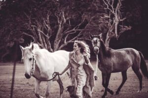 Isabel Lucas Instagram - My sister and I watched an unreal amount of horse movies growing up. All the classics; National Velvet, The Silver Brumby, The horse Whisperer, The Black Stallion, Pharlap, Spirit, The Man From Snowy River, the list goes on.

I’ve been following the powerful work of @kindfarmhorserescue. They’re a small, local (to me) organisation that re-homes horses in risk of slaughter, like older mistreated horses and ex-racehorses.

It’s moving to witness the evolution and healing, the light returning in their eyes and even their trust, playfulness restored when they find their a safe and healthy home. It reminds me of another childhood film; Black Beauty. 

You can support them here @kindfarmhorserescue 
Pictures from a few years back by @arterium with horses from @theranchbyronbay for ‘Sisters of Substance'. Bless you @arterium 

#thekindfarm #horsehealing #healinghorses