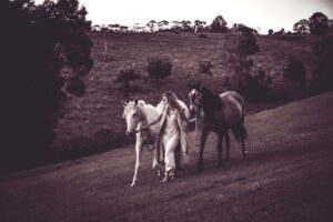Isabel Lucas Instagram - My sister and I watched an unreal amount of horse movies growing up. All the classics; National Velvet, The Silver Brumby, The horse Whisperer, The Black Stallion, Pharlap, Spirit, The Man From Snowy River, the list goes on.

I’ve been following the powerful work of @kindfarmhorserescue. They’re a small, local (to me) organisation that re-homes horses in risk of slaughter, like older mistreated horses and ex-racehorses.

It’s moving to witness the evolution and healing, the light returning in their eyes and even their trust, playfulness restored when they find their a safe and healthy home. It reminds me of another childhood film; Black Beauty. 

You can support them here @kindfarmhorserescue 
Pictures from a few years back by @arterium with horses from @theranchbyronbay for ‘Sisters of Substance'. Bless you @arterium 

#thekindfarm #horsehealing #healinghorses