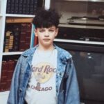 Ivana Miličević Instagram - Happy birthday to @tomofromearth: my brother. Pictured here, he is suffering through another one of my Halloween costumes. I believe this look here is “punk rocker”. We have a bowl cut transformed into a “mop of Robert Smith spaghetti” We have a very Punk Hard Rock Cafe Chicago T shirt. Very rare. A jean jacket. Tough. Not pictured: my fuchsia shiny leggings from dance class. Michigan. Circa 1990 ish? You’re still gorge. Happy birthday bro!