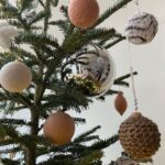 Ivana Miličević Instagram - Our #Christmastree this year! Mama and I wrapped some balls with string and crocheted some chains to wrap around others. Swipe to see close Ups. Also, the mushroom patch is how Phoenix hangs his ornaments every year. All in one place. I live. That is how mushies grow. #bohochic #bohochristmas