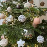 Ivana Miličević Instagram - Our #Christmastree this year! Mama and I wrapped some balls with string and crocheted some chains to wrap around others. Swipe to see close Ups. Also, the mushroom patch is how Phoenix hangs his ornaments every year. All in one place. I live. That is how mushies grow. #bohochic #bohochristmas