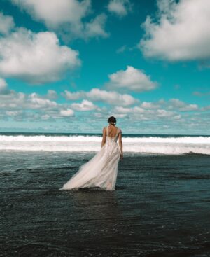 Jamie Bernadette Instagram - I saw a black sand beach in Hawaii in the encyclopedia when I was a child and it was right then I decided to get married there. Thank you to my husband @neikoalexander for making this dream come true and for being down to do this— it was quite an adventure. It was a long wayyyyy down that only a Jeep could make and there was a lot of mud and some in our party were scared. But, oh, was it worth it. This photo is by the incredibly talented photographer @kreativ808 Thank you for these gorgeous photos and your kindness, creativity, and professionalism. You were truly a blessing to our special day.