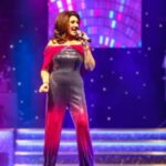 Jane McDonald Instagram - I loved this disco inspired jumpsuit! I bought in New York, it had a tequila sunrise vibe - and you know how I love a cocktail! I added a cape to cover my arms (which I’m conscious of). I absolutely loved performing in it!! (Photos from my 2019 Christmas show at @firstdirectarena in #leeds )