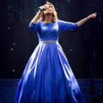 Jane McDonald Instagram - I first wore this gorgeous blue dress at my 2019 Christmas show. Designed by @kayheeley the dress has a nipped in waist and three-quarter length sleeves - a real classic! I can’t wait to share the outfits for my upcoming tour with you!