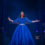 Jane McDonald Instagram - I first wore this gorgeous blue dress at my 2019 Christmas show. Designed by @kayheeley the dress has a nipped in waist and three-quarter length sleeves - a real classic! I can’t wait to share the outfits for my upcoming tour with you!