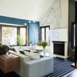 Janina Gavankar Instagram - This is Ms. @mandychengdesign . I’m so proud of what she did to my house. This is the living room, outfitted with @roveconcepts furniture, and a piece @livioramondelli drew, specifically for the wall/tv. The whole redesign can be found on @dwellmagazine . Feel free to AMA and I’ll answer! 📸 @madelinetolle