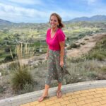 Jasmine Harman Instagram - Back in the office! And what a view! In the words of our sound recordist this morning: I’m suffering really badly with wind! 😝 💨 @aplaceinthesunofficial 👗 @cottontradersuk #monday #windswept #office