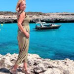 Jasmine Harman Instagram - Wow! The water here is just the most incredible colour! I’m back in Menorca for a revisit with some of my previous house hunters. Can’t wait to share these memories with you! Ps. Do you like my new boat!?!? 😜 @aplaceinthesunofficial #menorca #dreamscometrue #travel