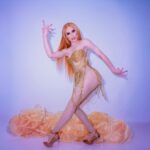 Jasmine Kennedie Instagram - ⭐️ Hallucinate ⭐️ Photo: @twamedia_ Outfit: @missmandella Overcoat: @gisforgodoy Hair: @jelani_wigs Tights: @stonedbyaleks #lipsyncassassin #jasminekennedie #showgirl #trans #transwoman #rupaul #dragrace #rpdr #rpdr14 #rpdras8 #allstars8 #thisismymoment #goldenhour