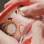 Jeanette Aw Instagram - I painted my very first Daruma doll in 2017 and I later featured it in my short film, Senses. Over the years, I’ve received several Daruma dolls. A few really special ones would be a custom made Daruma wearing the Le Cordon Bleu chef whites, one looking like a merlion, and a big gold one in my patisserie, with Once Upon A Time inscribed on it, gifted by the Daruma master himself. Other than being a symbol of good luck, do you know people often make a wish on a Daruma doll as well? You fill in the left eye of the Daruma while making a wish and when your wish is fulfilled, you fill in the other eye. 🤓