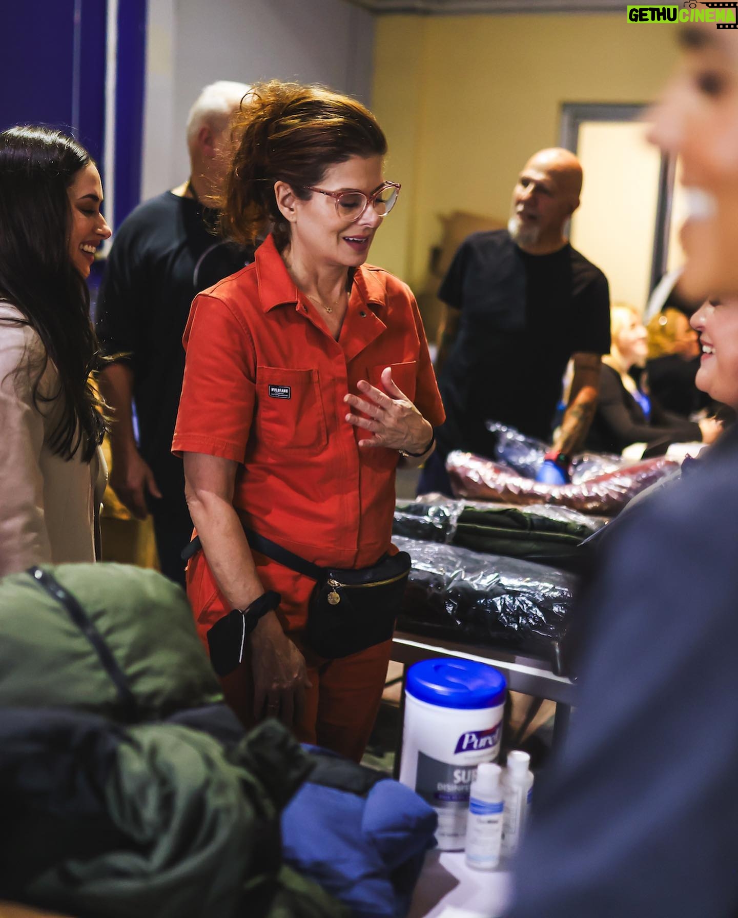 Jeanine Mason Instagram - During our visit, we were able to witness firsthand the services the city provides to these families and distributed 700 winter coats to every resident at the shelter for the upcoming weather. A wildly full circle moment for me! When my family immigrated to this country from Cuba, they were given coats through a federal program at the Freedom Tower in Miami before journeying to Connecticut for their first winter. I spent the morning talking to my mom about how she still remembers that moment and generosity. Thank you to @thisisabouthumanity for bringing community together in service of others and to the @nycemergencymanagement @zachiscol for coordinating the visit. These public servants are doing everything they can but the system is overrun and we need to take more steps to welcome people with dignity, to build more safe and humane immigration pathways, and to provide much more aid to cities like New York and others so they’re not left to burden this on their own. We all have a role to play, and that is why I encourage people to advocate for these policy changes and to follow @thisisabouthumanity, @immdef_lawcenter, and @fwdus to stay up-to-date on immigration policies and to learn about volunteer opportunities as they become available. #WelcomeWithDignity #ThisisAboutHumanity (Photos by @ericapress.jpg)