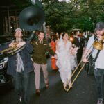 Jeanine Mason Instagram - Grey’s Anatomy actress @itsjeaninemason and her husband, Nicholas, had one main objective for their New York City wedding: “How do we use this celebration to hire as many artists as possible?” From Brooklyn-based artist @mokshini creating custom illustrations to their neighbor, a Broadway violinist, performing during the ceremony, New Yorkers’ inherent creativity made their mission come to life effortlessly. See all the details of their stoop wedding (the same place he proposed) and restaurant reception at the link in bio. 🌆❤️ 📷: @johndolanphotog 📋: @orangeandrose 💐: @tincanstudios 👗: @naeemkhanbride 📍: @monkeybar_ny
