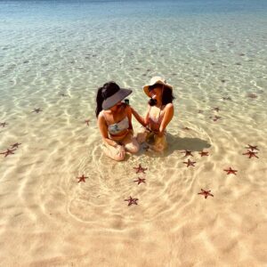 Jeannie Elise Mai Instagram - 📍Starfish beach 🇻🇳🏝️🌞🍹 ps if u look closely under my left cheek, u will spot my newest tattoo 😜 can anyone guess what it says lmao