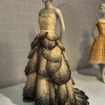 Jen Gunter Instagram – We went to the “Fashioning San Francisco” exhibit at the @deyoungmuseum and here are some of my favorite outfits. 

The first two images are the Junon dress (Dior), and it is breathtaking. 

I also loved the red, pirate-esque dress, which I think was Comme des Garçons and the tea length black dress with the stunning pleats (also a Dior). I was left feeling a bit like Mrs. Harris…oh to have a Dior gown. 

The skills required to produce some (likely all) of these outfits are something to behold. For the purple pleated dress at the end it took 7 yards of fabric to make one yard of pleated fabric! 

The shoe exhibit was a disappointment. Maybe 9 or 10 pairs of shoes! Sigh.
