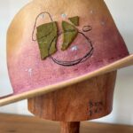Jenna Elfman Instagram - The universe doing its thing! 🤘🏽👀🤘🏽 This hat, born from a spontaneous experiment, became a canvas for a new idea. Hand-dying the felt added that extra touch of uniquness. I hadn’t played with dye before this, so I was excited to see how it would turn out. While I was literally putting the finishing touches to this hat, I recieved a call from the lovely @therealkateceberano looking for a special gift for her dearest friend of 25 years, @jennaelfman in town for just a brief visit. Timing would be tight to make something that quick, but the universe stepped in when I shared a photo of this hat in progress. Instantly, we knew it was the perfect creation. These abstract hats aren’t for everyone, and that’s the point. They’re crafted for the ones meant to wear them. The universe works in mysterious ways, connecting us with the right person at the right time. Such a joy to meet you, Jenna! Wishing you an incredible time in Australia. And sending heaps of love to you, Kate. 🫵🏼💜 Special mention to @adamsavillebrown for being in the right spot at the right time also. 🤘🏽 #hatmaker #artist #universe #customhat #connection #friends