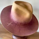 Jenna Elfman Instagram - The universe doing its thing! 🤘🏽👀🤘🏽 This hat, born from a spontaneous experiment, became a canvas for a new idea. Hand-dying the felt added that extra touch of uniquness. I hadn’t played with dye before this, so I was excited to see how it would turn out. While I was literally putting the finishing touches to this hat, I recieved a call from the lovely @therealkateceberano looking for a special gift for her dearest friend of 25 years, @jennaelfman in town for just a brief visit. Timing would be tight to make something that quick, but the universe stepped in when I shared a photo of this hat in progress. Instantly, we knew it was the perfect creation. These abstract hats aren’t for everyone, and that’s the point. They’re crafted for the ones meant to wear them. The universe works in mysterious ways, connecting us with the right person at the right time. Such a joy to meet you, Jenna! Wishing you an incredible time in Australia. And sending heaps of love to you, Kate. 🫵🏼💜 Special mention to @adamsavillebrown for being in the right spot at the right time also. 🤘🏽 #hatmaker #artist #universe #customhat #connection #friends