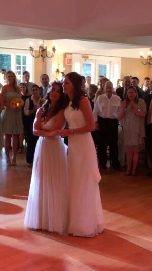 Jenna Laurenzo Instagram - "There you were, and there I was,
Was it fate or from above?
Either way, I found just what I need..." - Joy Williams, "What Can I Do (But Love You)"

Back in June, 2016, I married my dancing partner. Every June we celebrate Pride and our anniversary as we continue this journey together.

We took a few lessons to make sure we could twirl each other before we realized we could figure it out ourselves. 

Surrounded by friends and family we took each other's hands, twirled a little, laughed a lot...and loved even more 🥰

I suggested having guests throw glitter at us, but Aine thought that would be a TERRIBLE idea. So we gave our bridesmaids tambourines instead - to shake, still achieving that "shimmer" in a more practical way. This compromise pretty much sums up our continual dance ❤️

Happy Pride 🏳️‍🌈 

#loveislove #pride #lgbt #lgbtpride #twobrides #lovewins #pridemonth #lesbianlove #lesbianpride  #wedding #rainbow #lgbtqia #queer