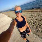 Jenni Falconer Instagram - Do you run on holiday? ☀️ If you don’t, you should, it’s the best. Run at your own pace, there’s no race; you get to explore, enjoy the sunrise and if you’re somewhere like this, you can run by the sea, and along the beach. It’s one of my favourite things about a holiday-in fact before I book a trip away, I usually checking out the running options! Anyway, the south of Spain is one of my favourites. ❤️🇪🇸🏃🏼‍♀️ Happy running. 😘 And before I’m asked…. -top and shorts are @sweatybetty -trainers are Ghosts from @brooksrunninguk 💙 #runpod #runner #run #runningonholiday #holidayrunning #holidayrun #andalucia