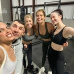 Jennifer Holland Instagram – When the gorgeous ladies of @dcofficial #Superman invite you to workout with them and our personal trainer @paolomascitti at 6:45am, you DO NOT hesitate. 
Okay, maybe you hesitate a little, but you do it without complaint.
Or, maybe you complain… an embarrassing amount.
Probably your under-eyes will never look the same.
But, definitely worth it. #worthit #bestcastever 

#harcourt #emiliaharcourt #peacemaker #theengineer #angelaspica #eveteschmacher #loislane