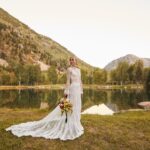 Jennifer Holland Instagram – James! Thank you for sharing your love, life and family with me. Thank you for choosing me, for elevating me, and for always making me belly laugh. Here’s to many more years to follow the first extraordinary 7. 
………………………………………..
@jamesgunn and I got married surrounded by the most beautiful humans, the most magical scenery, and endless love and laughter. My gratitude is bursting at the seams. Thank you to every single staff member who worked so hard to make this event special for us and for our guests. It was so seamless and stunningly beautiful, I felt like I was in a movie. We only had one uninvited guest: Mr. Bull Moose. But, he sort of lives there. So, I guess we were in his home.
My Hair: @lisasatornhair 
My MU: @rachelgoodwinmakeup 
James grooming: @louisemooninc 
Stylist: @carrielauren 
@lexfordays @victordevita 
Photos 1,2,3,4,6,7,9: @jonnymarlow 
Photos 5, 8: @jessmigliophoto
Event coordinator: @eksevents