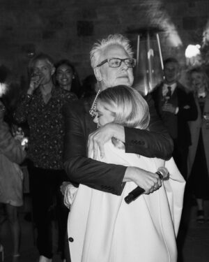 Jennifer Holland Instagram - Fun Fact: James gave a speech at our wedding Welcome Party where he said “I don’t know where my fiancé has run off to, but we both want to thank you from the bottom of our hearts…” thing is- I was standing right where I am in these photos. @jonnymarlow caught the exact moment that the whole party was laughing and James was confused. Everyone thought it was a comedy ‘bit’ we had planned. It was not a bit. James just truly didn’t see his wife standing directly next to him. And it was hilarious. 
When I think about what makes my life colorful, what makes my house feel like a home, what makes me excited about new experiences and what makes me excited about experiencing life’s wonders… it’s you. My better half. My best friend. My dog’s cuddle buddy and my other dog’s chew toy. Without you, life doesn’t make sense. 
Happy birthday, @jamesgunn 🎂 🫶🏻