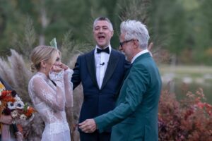 Jennifer Holland Instagram - James! Thank you for sharing your love, life and family with me. Thank you for choosing me, for elevating me, and for always making me belly laugh. Here’s to many more years to follow the first extraordinary 7. 
………………………………………..
@jamesgunn and I got married surrounded by the most beautiful humans, the most magical scenery, and endless love and laughter. My gratitude is bursting at the seams. Thank you to every single staff member who worked so hard to make this event special for us and for our guests. It was so seamless and stunningly beautiful, I felt like I was in a movie. We only had one uninvited guest: Mr. Bull Moose. But, he sort of lives there. So, I guess we were in his home.
My Hair: @lisasatornhair 
My MU: @rachelgoodwinmakeup 
James grooming: @louisemooninc 
Stylist: @carrielauren 
@lexfordays @victordevita 
Photos 1,2,3,4,6,7,9: @jonnymarlow 
Photos 5, 8: @jessmigliophoto
Event coordinator: @eksevents