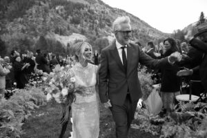 Jennifer Holland Instagram - James! Thank you for sharing your love, life and family with me. Thank you for choosing me, for elevating me, and for always making me belly laugh. Here’s to many more years to follow the first extraordinary 7. 
………………………………………..
@jamesgunn and I got married surrounded by the most beautiful humans, the most magical scenery, and endless love and laughter. My gratitude is bursting at the seams. Thank you to every single staff member who worked so hard to make this event special for us and for our guests. It was so seamless and stunningly beautiful, I felt like I was in a movie. We only had one uninvited guest: Mr. Bull Moose. But, he sort of lives there. So, I guess we were in his home.
My Hair: @lisasatornhair 
My MU: @rachelgoodwinmakeup 
James grooming: @louisemooninc 
Stylist: @carrielauren 
@lexfordays @victordevita 
Photos 1,2,3,4,6,7,9: @jonnymarlow 
Photos 5, 8: @jessmigliophoto
Event coordinator: @eksevents