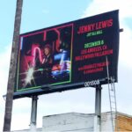 Jenny Lewis Instagram – the JOY’ALL BALL 
rolls on tomorrow at the @hollywoodpalladium 
w @shabazzpalaces & @loganledger 
there are still a few tix avails ! 
omg i’m on a motorcycle  on a friggin billboard in LA! 📸 by @mamahotdog 

we out here having a ball y’all. 
not only did i get my hair did  by @jayne_edosalon in Jerry’s dressing room @thewarfield but i sat in the @prince chair @roselandpdx 
we visited the amazing @madonnainn1958 & 
two in our traveling party got ass tats 
i hung w @deanjohnsongs 
who put out a gorgeous record this year 
@sinagrace made this poster after seeing us @venturamusichall 
we’ll have a limited run at the @hollywoodpalladium 
the @dwcweb will be there 
as well with information on how to help out! 
if you want to bring a christmas ornament for the red stage tree 
they are welcomed !  you can leave em at merch if you want to help decorate! 
we’ll have some old merch designs as well in the shop and a limited edition JOY’ALL jewelry line by @makerandsmith 
well, what else can i say but 
it’s almost christmas! 
best,
JL & @bobbyrhubarblewis