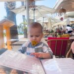 Jessica Fox Instagram - Palma. Palma. Palma. 1. Bucket and Sand and rocking his @littlegreenradicals swimsuit. 2. Perusing the menu. 3. Mirror selfie. 4. Daddies cuddles. 5. Poor bar fun in more @littlegreenradicals 6. Keeping it cool in @sunniesforkids and @mumandme_app 7. Matchy, Matchy. 8. Long day. 9. Mini Mohawk. 10. When you think you order baby friendly and it arrives raw and on fire. *items mentioned PR