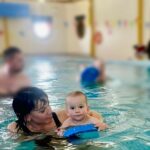 Jessica Fox Instagram - Swimming! We started our lessons with @waterbabies when River was teeny tiny and he absolutely loved them! Then came all the illnesses you get once you expose them to the world, the teeth, the separation anxiety and the million other things that can rock your small persons world. We missed a few lessons and some became quite stressful, but @lets_teach_your_baby_to_swim has been very kind, patient and supportive and yesterday’s lesson was so much fun! I can all of a sudden see progress in River (very good holding on) and both of us were beaming from ear to ear! #pr #ad