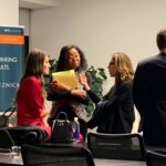Jessica Versteeg Instagram – Another great panel from #blockchainweek in #NewYork!  We talked about everything from cannabis on the blockchain @paragoncoin to the future of cryptocurrency. In this clip I was talking about banks and and what they are doing to the poor. The question was, where do I see bitcoin in 5 years? 
It may be hard for some of you to believe, but there are two billion people in the world that still do not have a bank account. This means they do not have access to the security a bank can provide or the convenience of paying a bill online. 
What’s even more shocking is that there are many people in the US that do not have a bank account. Without access to savings and credit, these people cannot participate in the virtuous cycle of economic growth, this is just one of many vicious cycles that is keeping the poor, poor.

Part of this evil banking cycle that keeps the poor, poor is when the banks charge people for not maintaining a minimum balance, basically not having enough money. Anywhere from $5 to $25 per month (that’s a lot when you are living paycheck to paycheck). Imagine paying your own way through college,  rent,  insurance,  food,  books,   mwhatever college kids have to pay for, working nights while going to school all day and living paycheck to paycheck. Then imagine a bank charging you for not maintaining the balance they want you to have. All while knowing the bank is playing with your money (Banks use the money deposited by their customers to make money, both directly and indirectly). Imagine being a single mom, working 2 jobs, raising 3 kids, living paycheck to paycheck. Just trying to keep food on the table, a roof over the head of the children she wants to protect, paying for school activities, clothes for kids that keep growing, and then seeing the bank is charging you for not maintaining the minimum balance (shout out to my mom!). All while knowing when she deposits her hard earned money, the bank is turning around and investing her hard earned money by giving loans to other bank customers so they can earn interest — yet she does not have enough to take out a loan for herself.