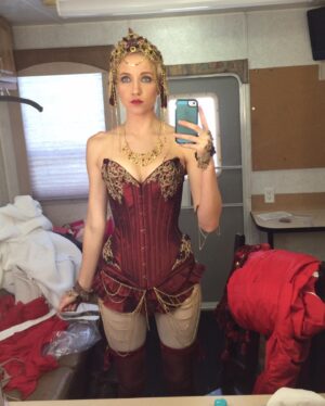 Jessy Schram Instagram - #TB to #LizzieBordenChronicles 🪓🩸First day on set called for a belly dance in a corset while chopping off a paper machete head with red streamers spurting from a dummy’s body. The cast and costumes on this were 🔥🔥and I so very appreciate having played Miss O’keefe.
