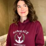 Jewel Staite Instagram - Is it even the holidays if you aren’t wearing your @romance__university swag?