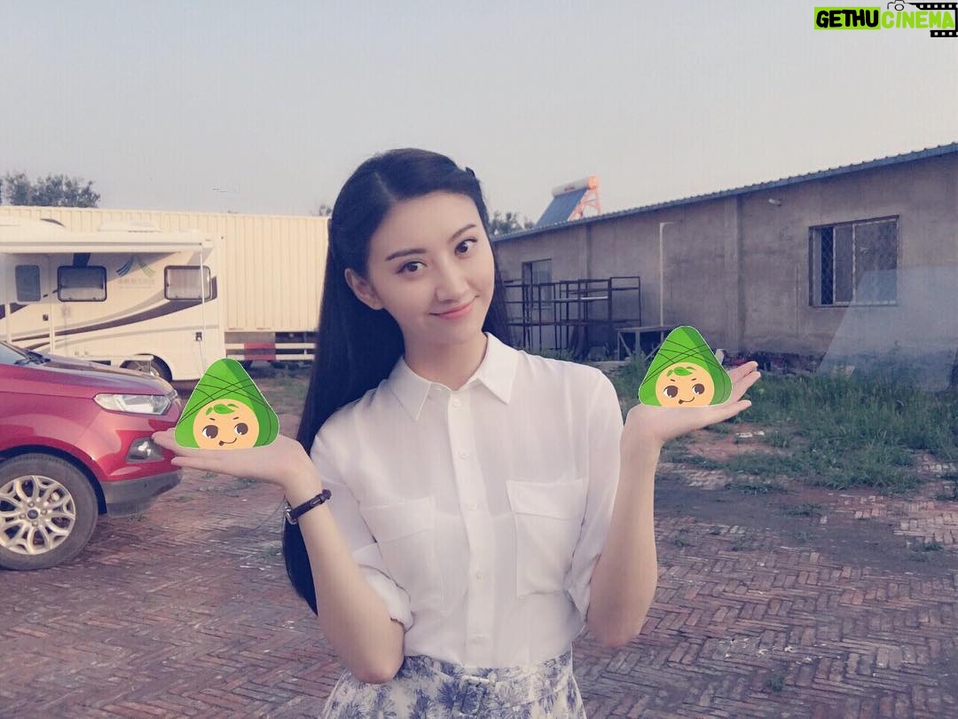 Jing Tian - 10.7K Likes - Non-breaking Dragon Boat Festival Holiday~ Picture of “having” rice-pudding on set… We have sweat ones and we have salty ones,now who's the winner this year?