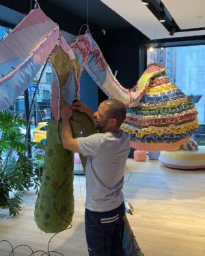 Joana Vasconcelos Instagram - Currently in NYC our dedicated team is putting the final touches on a special installation for Roche Bobois’ 50th anniversary in the US. Stay tuned for the reveal!

🗽🗽🗽

Atualmente em Nova Iorque a equipa do atelier está a dar os últimos retoques numa instalação especial para o 50º aniversário da Roche Bobois nos EUA. Esteja atento para ver o resultado final!

@rochebobois 
#JoanaVasconcelos #RocheBobois #NYC #ArtInProgress #NYCArt #ComingSoon #WIP #TextileArt #ArteTextil #Escultura #Sculpture #ArteContemporanea #ContemporaryArt #Art #Arte