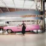 Joanne Peh Instagram - Dancing to my pink Cadillac. Gorgeous display of vintage automobiles, and a wealth of car history. But amongst them all, my heart was stolen by one. 😂 @autoworld_brussels