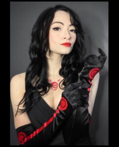 Jodelle Ferland Instagram - happy halloween🎃 last year I went as winry from fullmetal alchemist, so I figured I’d continue the theme this year and dress as one of my favourite FMA villains, lust❤️ #fullmetalalchemist #fmabrotherhood #lustcosplay #fmalust #fmacosplay