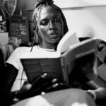 Jodie Turner-Smith Instagram - so proud to call myself a part of the @stoneisland family ✊🏿🖤 we all have a compass inside… listen to it… and follow your own ✨ shot by the talented jezza @jeremyelkin narrated by my obsession @santandave a very special thank you to @robert.triefus for including me, for seeing my spirit and for always supporting me at every moment. and a big shoutout to @roundtablebooks, the best (&BLACK-OWNED!) bookshop in all of london, for opening their doors early and letting me live among their books. had to buy a whole new suitcase to get all the books i bought back to LA! #TheCompassInside #AndYesIDidAccidentallyLeakThisYesterday #SozButNotSoz