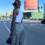Jodie Turner-Smith Instagram - next stop 🛫🛬📍MILANO! cannot wait to see what you’ve got in store for us @sabatods @gucci 😻❤️‍🔥✨ (swipe to see me trying not to get hit by a car whilst taking a photo with this billboard on sunset blvd milan travel dump)