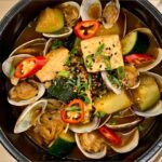 Judy Joo Instagram - Savour the robust flavours of Korea with my hearty Doenjang Jjigae (Korean Fermented Soybean Stew) 🇰🇷 This stew is a staple in Korean cuisine, with its deep, rich taste that comes from the aged doenjang - a testament to the beauty of fermentation. 🍲 Like a fine wine, it only enhances with time, providing an unmatched depth to this beloved dish. Here’s how to elevate your Doenjang Jjigae experience: Use fresh clams to infuse the stew with the essence of the sea. Choose a traditional earthenware bowl, ttukbaegi, to maintain the stew’s hot temperature. Add a drizzle of toasted sesame oil just before serving for that aromatic finish. Garnish with black sesame seeds and freshly sliced scallions for a burst of colour and freshness. Serve alongside fluffy, steaming rice for the ultimate Korean comfort food experience. Whether you’re new to Korean flavours or a seasoned aficionado, this Doenjang Jjigae is sure to satisfy. Find the full recipe and dive deeper into the delicious world of Korean cuisine at Judyjoo.com - link in bio! • • • • #JudyJooKitchen #KoreanCooking #DoenjangJjigae #KoreanFood #Foodie #FoodLover #FoodPhotography #ChefLife #FoodBlog #Fermentation #InstaFood #FoodStagram #Umami #ComfortFood #FoodPassion #FoodArt #FoodCulture #CookingAtHome #Homemade #RecipeOfTheDay #EarthenwareCooking #TraditionalCuisine #FoodInspiration #Gourmet #korea #korean #koreanfoodmadesimple