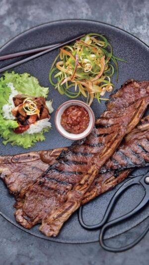 Judy Joo Instagram - Feast your eyes on the Ultimate Korean BBQ Beef Short Ribs (Galbi) 🇰🇷

Galbi is a classic grilled dish that marries Korea’s famed sweet and umami filled soy based marinade with the savoury smokiness of a charcoal grill. The two techniques create a bbq dish you won’t forget and the family will love. 🥩🔥

Elevate your Galbi with these tips:

Choose bone-in LA Galbi cut short ribs or trimmed boneless rib-eye steak for a succulent dish.

Use Asian or ripe pears in your marinade for an authentic Korean sweetness.

Fresh ginger and garlic bring aromatic nuances you won’t want to miss.

Dark brown sugar adds a richer, complex sweetness.

Roasted sesame oil imparts a nutty, toasty character.

Marinate the beef for at least 2 hours, or better yet, overnight, for the deepest flavours.

Serve with red or green lettuce leaves, perilla leaves, steamed white rice, spicy lettuce wrap sauce (ssamjang), spicy scallion salad, and kimchi for the complete Korean BBQ experience.

And remember, you can always adapt your Galbi using local ingredients you love and have available!

Head to the link in my bio for full ingredients and instructions, or visit Judyjoo.com 🙌
•
•
•
•
#chef #chefs #cook #cooking #cheflife #chefsofinstagram #foodart #foodblog #foodculture #foodgasm #foodie #foodiegram #foodielife #foodinspiration #foodlover #foodpassion #foodphotography #foodporn #foodstagram #gourmet #instafood #korea #koreanfood #truecooks #beef #beefshortribs #bbq #galbi #koreanbbq #koreanfoodmadesimple