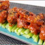 Judy Joo Instagram - Hailing from the great state of New Jersey– I grew up eating buffalo wings. There was even a buffalo wings site on campus at my college in NYC called Pluck U. (who else remembers this chain? It was started by Columbia and NYU grads). It was open late, and our go to place for midnight munchies! And, yes they do come from Buffalo, NY, a city upstate known for their bitterly cold winters and their nuclear hot wings. Here, I have twisted up the traditional Buffalo wings with a fusion of East meets West. Believe me, I am a mega fan of the original wing slathered in Frank’s hot sauce. But, these Korean-esque wings are drenched in a delectably spicy gochujang based hot sauce, offering a more earthy and umami flavor. With the perfect balance of heat, tang, and a hint of sweetness, each bite is an adventure in itself. Elevate your Korean Buffalo Wings experience with these tips: Ensure your wings are well-coated in potato starch for that irresistible crunch. Fry to golden perfection and toss well in the sauce for a glossy spicy finish. Serve hot and garnish with sesame seeds and finely chopped spring onions for an added burst of freshness. And, a side of your fave blue cheese dressing! Discover the full recipe and embark on your culinary exploration of Korean flavours at Judyjoo.com - link in bio! • • • #JudyJooKitchen #KoreanCooking #KoreanBuffaloWings #KoreanFood #Foodie #FoodLover #FoodPhotography #ChefLife #FoodBlog #Spicy #InstaFood #FoodStagram #FlavourBurst #ComfortFood #FoodPassion #FoodArt #FoodCulture #CookingAtHome #Homemade #RecipeOfTheDay #CrispyWings #FusionCuisine #FoodInspiration #Gourmet #korea #korean #koreanfoodmadesimple