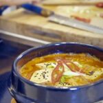 Judy Joo Instagram – It’s freezing outside!  And, the best time to enjoy this soul-warming Kimchi Jjigae! A staple in Korean households, this stew marries pork belly with deeply fermented kimchi, creating a blend of spicy, savory, and tangy flavors. 

The key to this warming soup’s rich depth of flavor is  very ripe fermented kimchi, simmered with pork to perfection. Add tofu at the end for a textural  contrast and a drizzle of nutty sesame oil for fragrance. 

This stew usually comes to the table bubbling in a ceramic bowl straight off the stove.  It is a comforting dinner that warms you from the inside. Each bite of this Kimchi Jjigae is a journey through Korea’s rich culinary heritage. Explore this recipe and more at Judyjoo.com or click the link in my bio.
•
•
•
•
#JudyJoo #KoreanCuisine #KimchiJjigae #ComfortFood #KoreanStew #PorkBelly #Kimchi #Gochujang #Tofu #CookingMethod #AuthenticKorean #FoodJourney #HeartyMeals #SpicyStew #WinterWarmers #KoreanCooking #HomeCooking #CulinaryArt #FlavourJourney #GastronomicAdventures #CelebrityChefs #FoodWorld #ChefLife #CookingPassion #CulinaryArt #FoodLovers #CulinaryExcellence #ChefsOfInstagram #Korea #Korean #Koreanfood #KoreanCooking