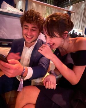 Julia Butters Instagram - At 13 years old, @julia_butters (Julia Butters) has already acted in two best picture-nominated films. Here’s #10Things with “The Fabelmans” actress ahead of the 95th Annual Academy Awards. ❤️ ⁣
 ⁣
1. All dressed up (with somewhere fabulous to go) on a night out in Hollywood. ⁣
2. A very proud brow moment.⁣
3. Julia’s must-have movie snacks. 🍿⁣
4. Quick fit check. ⁣
5. Bestie @mckennagraceful (Mckenna Grace) hyping Julia up.👯‍♀️⁣
6. Waiting on the chauffeur (aka dad).⁣
7. Is there a better  1? (Also dad.)⁣
8. “I love you” texts.⁣
9. A surprise on Sunset Boulevard. 🌇💫⁣
10. Reunited (with a “The Fabelmans” cast member!) and it feels so good.