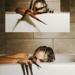 Julia Hart Instagram - 🛁time to get out🖤 • • • I’ve had the idea to do a tub photoshoot with Julia for a while, & I’m so happy we were able to bring it to life while we were together for Revolution! This bathroom was so pretty & the lighting made it look so spooky! We love how these turned out! • • • Model :: @thejuliahart Taken with the @canonusa R6 w/ 24-70mm f/2.8 • • •
