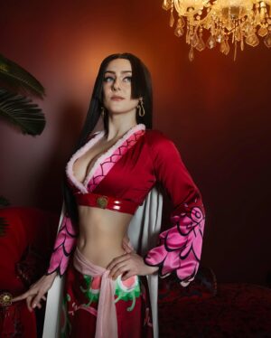 Julia Maggio Instagram - Kneel before me or be turned to stone! 🩷
Pirate Empress, Captain of the Kuja pirates, Warlord of the Sea - Boa Hancock
 📸: @roxcosplays 
My first One Piece cosplay! 🏴‍☠️☠️🩷
#anime #manga #cosplay #onepiece #boahancock #boahancockcosplay