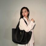 Julia Wu Instagram - 🍂 vintage top, modern bag 🪶 @ysl