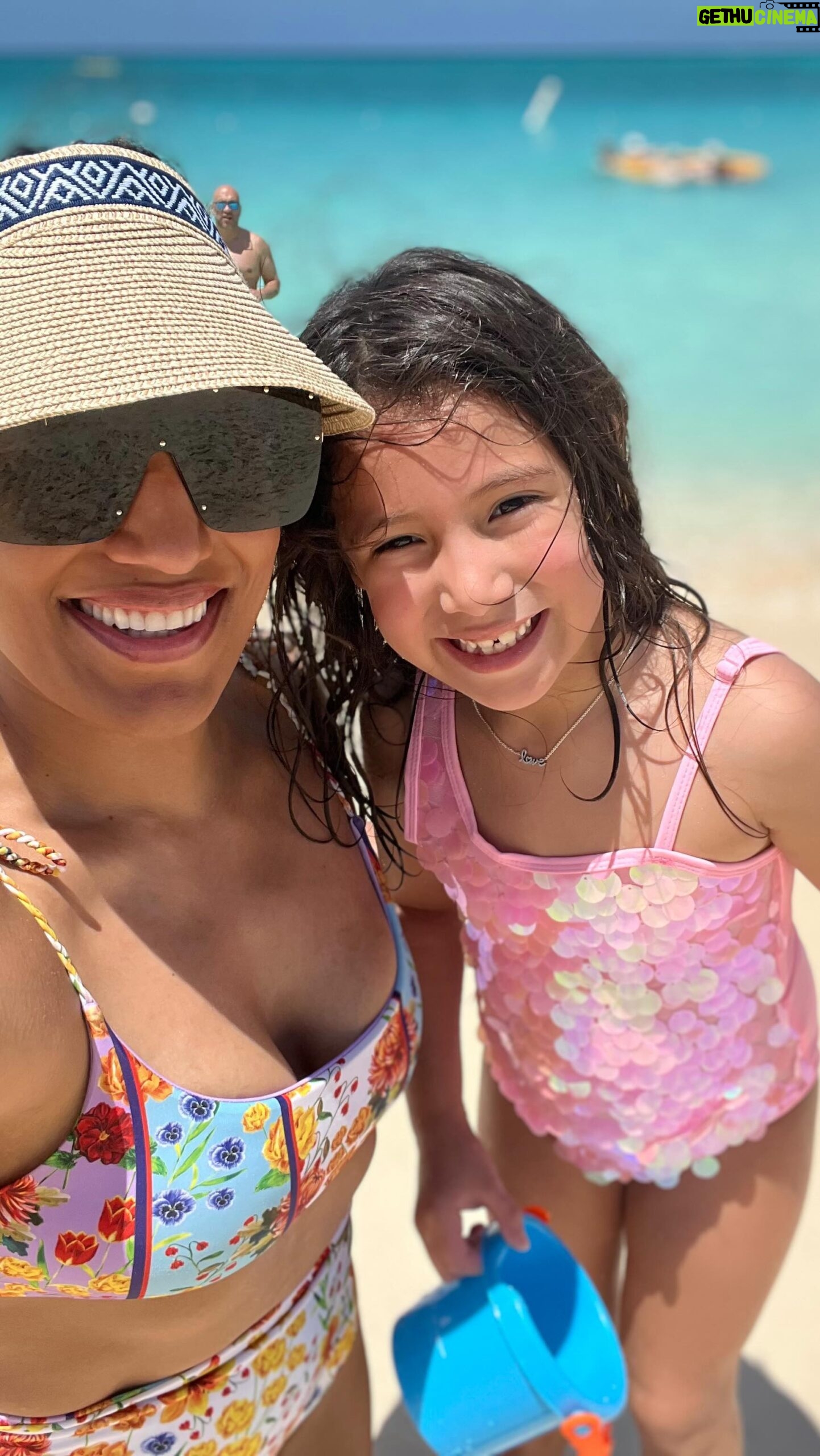 Julianna Peña Instagram - I took my baby to #grandcayman for #springbreak and it was one for the ages! We snorkeled at #stingraycity (I kissed the #stingray for 7 years good luck 🍀😆) swam with the turtles and starfishes, swam in EVERY AND ALL pools, built sandcastles, collected seashells, and body surfed the waves with my baby on my hip which was my favorite part ! I got ate up by that sun which I didn’t think was possible but it was so worth it! It was the most beautiful vacation I’ve ever been on and everything was so beautiful and peaceful! 10/10 🌊 ☀️ 🐠 🏝️ 🌴 🌺